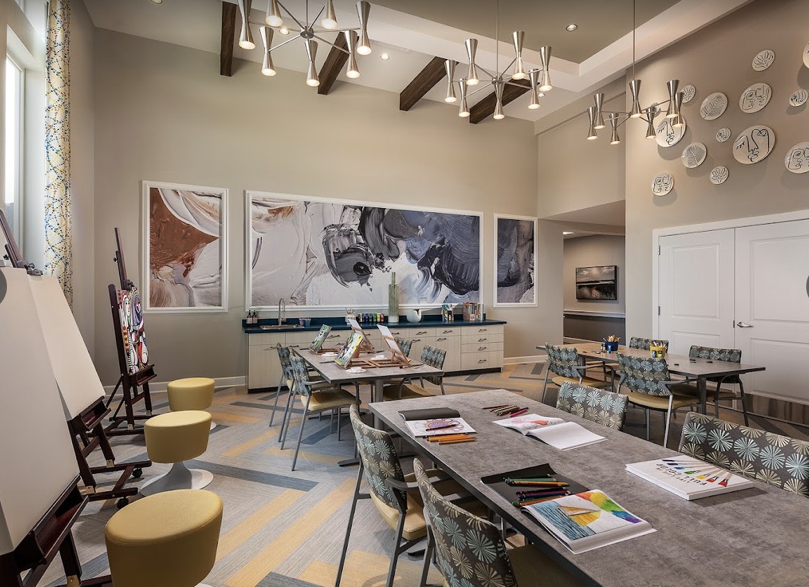 A modern meeting room featuring contemporary artwork and stylish furniture.