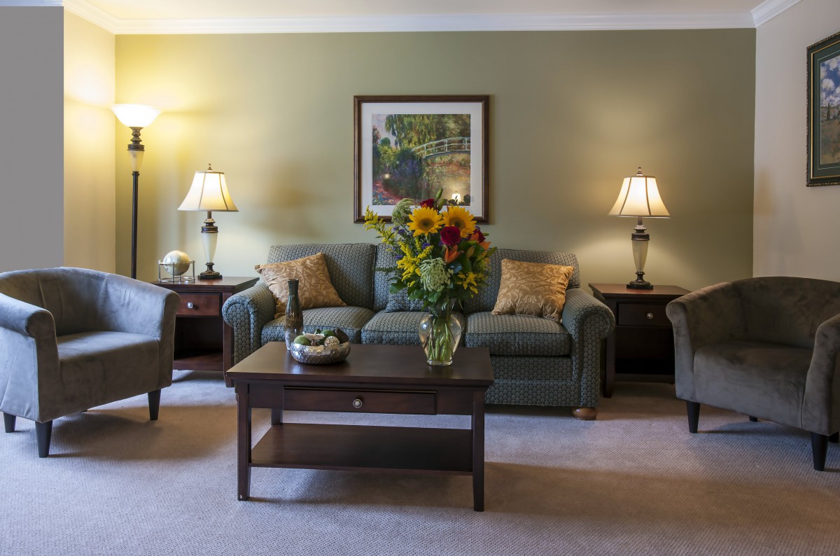 A cozy living room with a sofa, coffee table, and stylish decor.