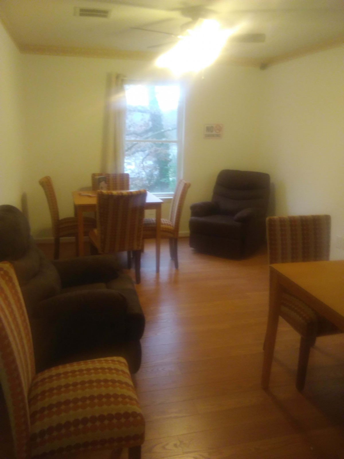 A cozy living room with a dining table and comfortable seating.