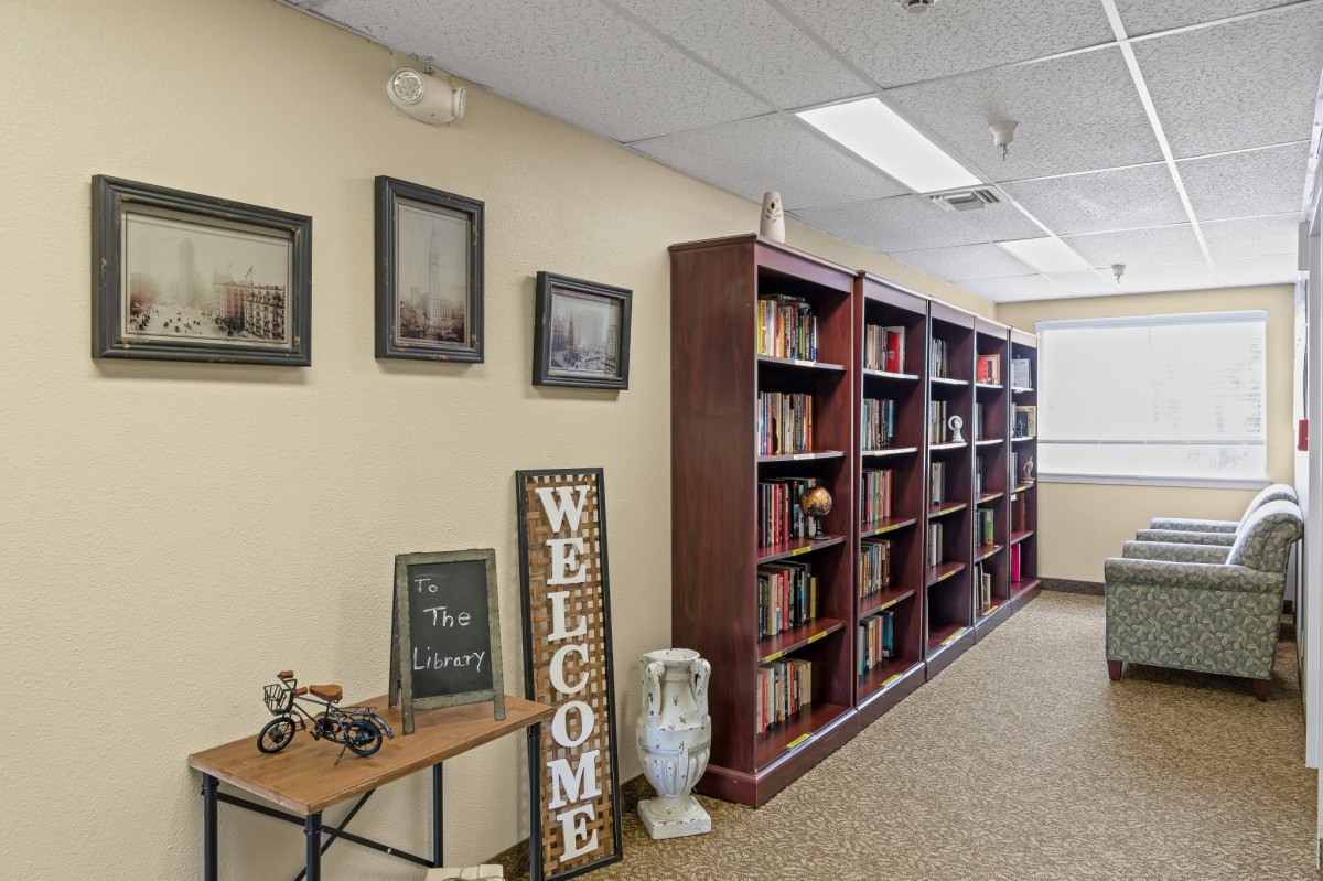 A cozy library corner with bookshelves and welcoming decor.