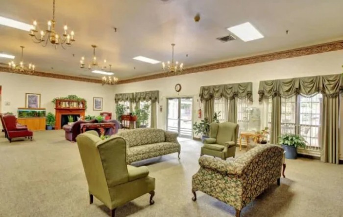 A cozy living room with vintage furniture and chandeliers.