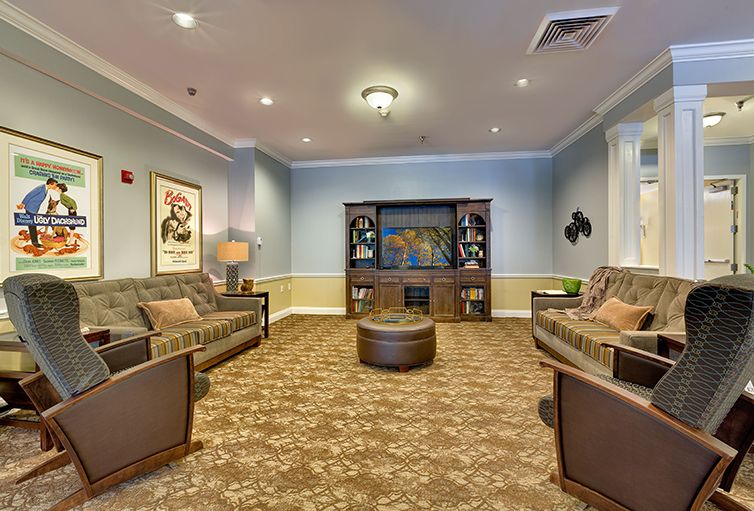 A cozy living room with sofas, a coffee table, and a television.