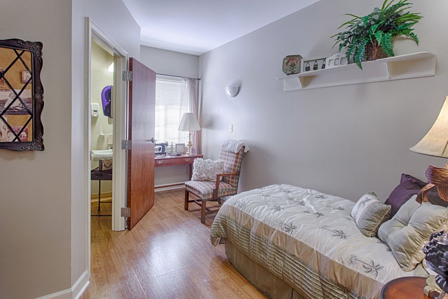 A cozy bedroom with a single bed and wooden furnishings.