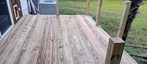 A newly constructed wooden deck, showcasing the natural grain of the wood.