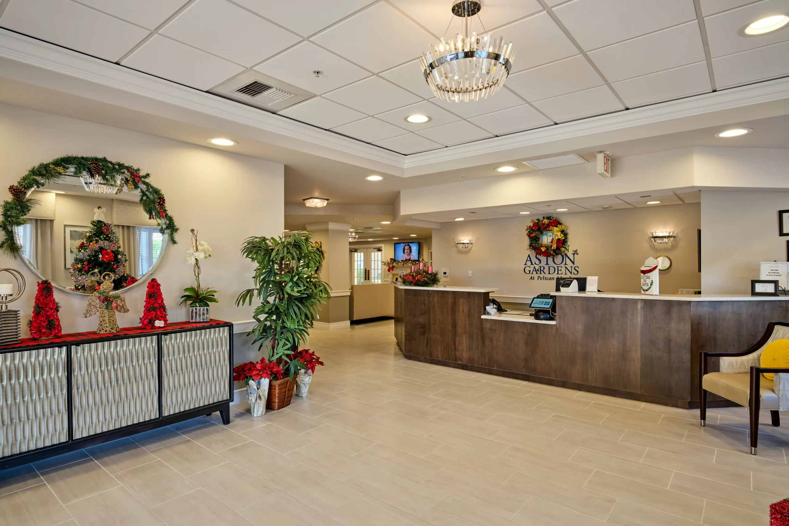 A warmly decorated reception area adorned with Christmas decorations and elegant lighting.