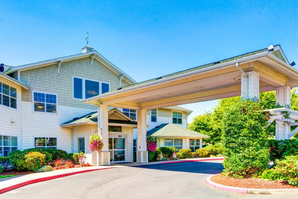 A welcoming entrance to a residential building on a bright, sunny day.