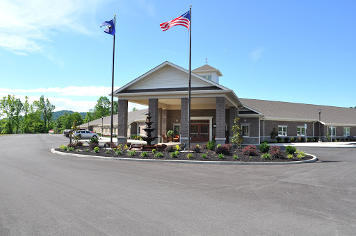 Welcoming entrance of a hotel with flags fluttering in the breeze.