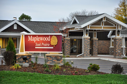 Exterior view of the Maplewood Senior Living facility, showcasing its welcoming entrance and landscaped surroundings.