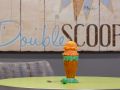 Colorful toy ice cream cone on a table with 'Double Scoop' in the background.