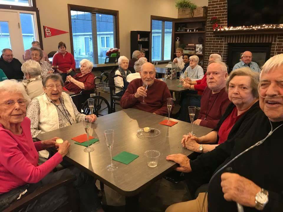 A group of seniors enjoying a social gathering at a community center.