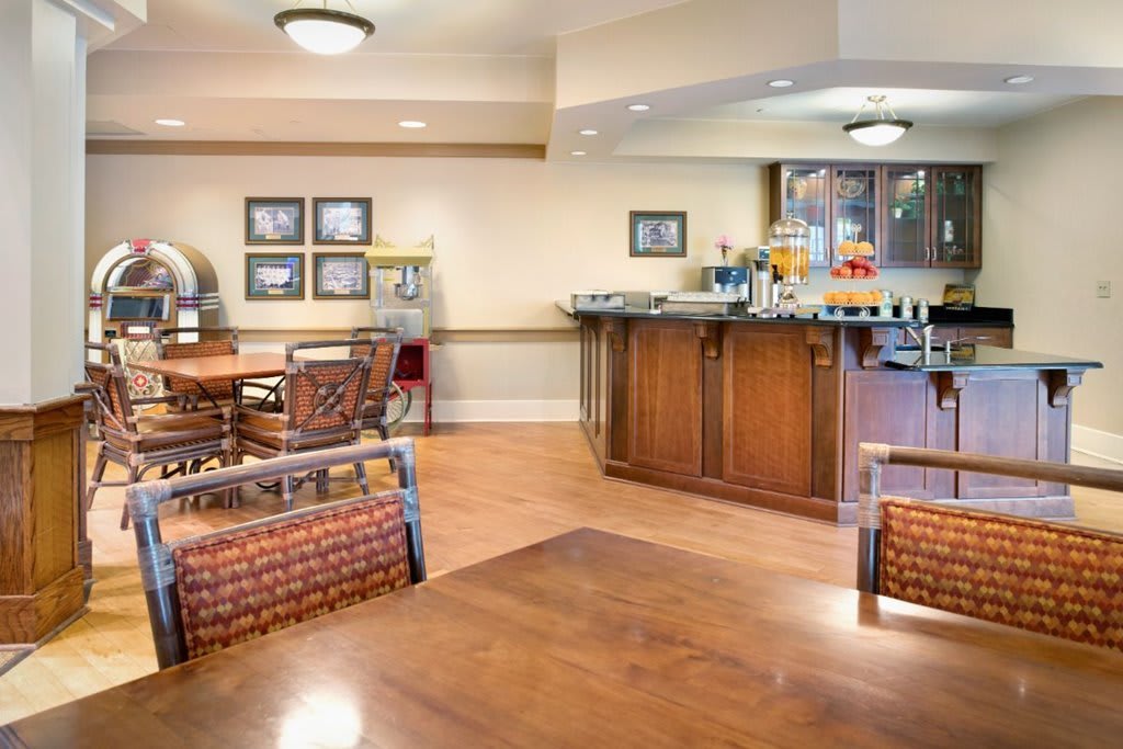 A cozy cafe interior with wooden floors and comfortable seating.