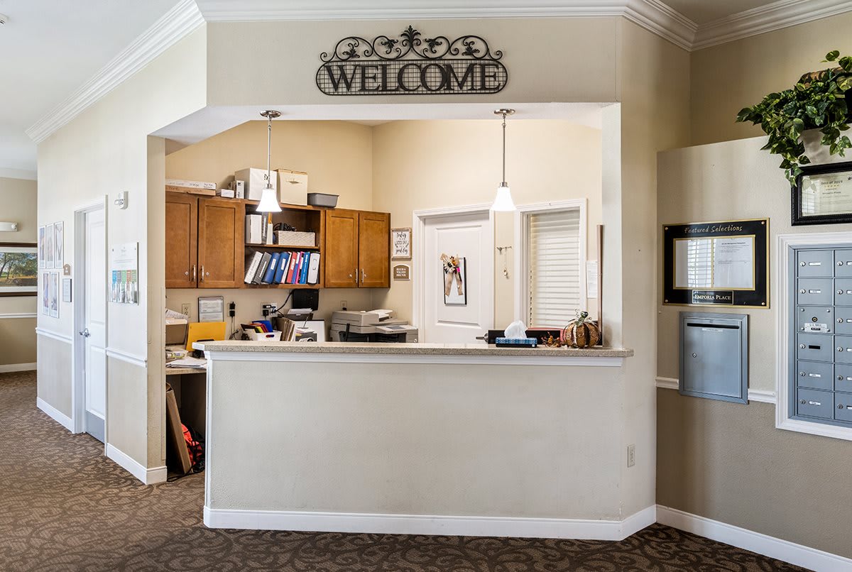 A welcoming reception area with a front desk and a 'Welcome' sign.