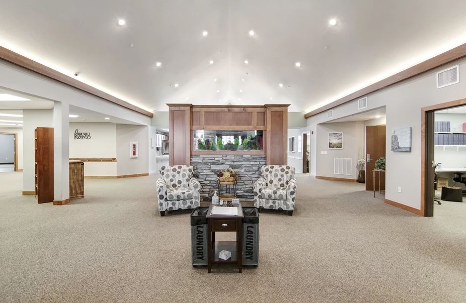 A spacious and modern living room with comfortable seating and elegant decor.