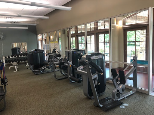 A view of a well-equipped gym showcasing various exercise machines.