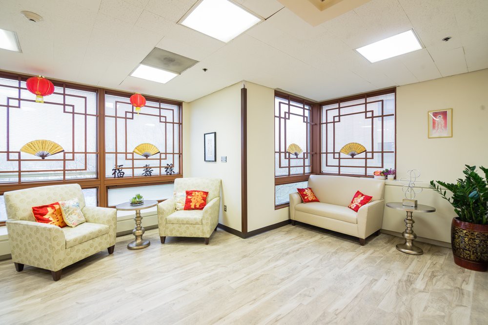 A cozy waiting room with comfortable seating and decorative elements.
