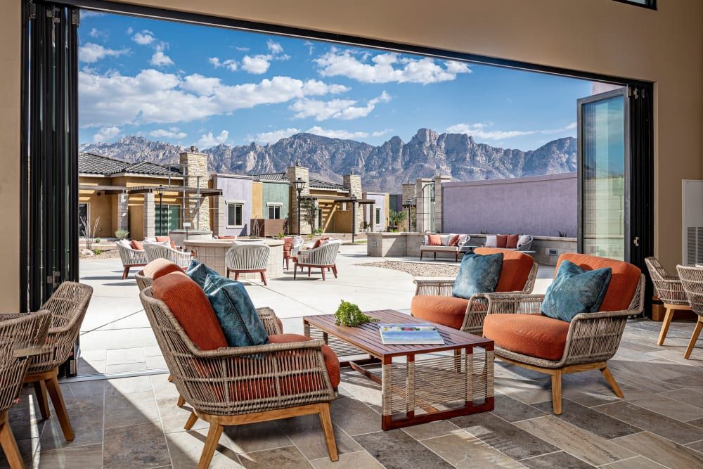 A luxurious patio with comfortable seating and a stunning mountain view.