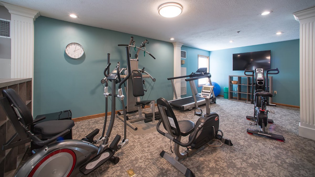 A home gym with various exercise equipment for workouts.