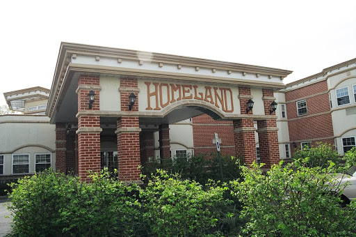 A well-designed brick building with 'HODELAND' prominently displayed on the facade.