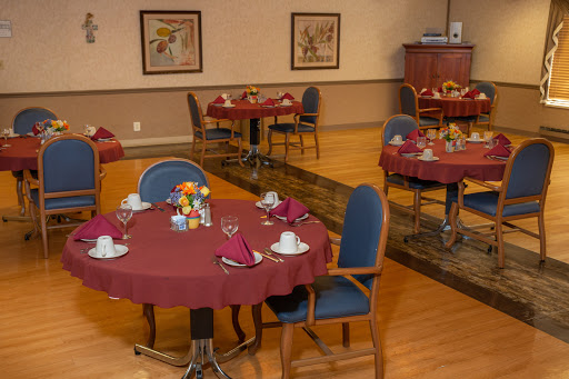 A beautifully arranged dining area with round tables set for guests.