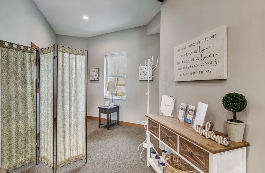 A cozy hallway with wall art and organized wooden furniture.