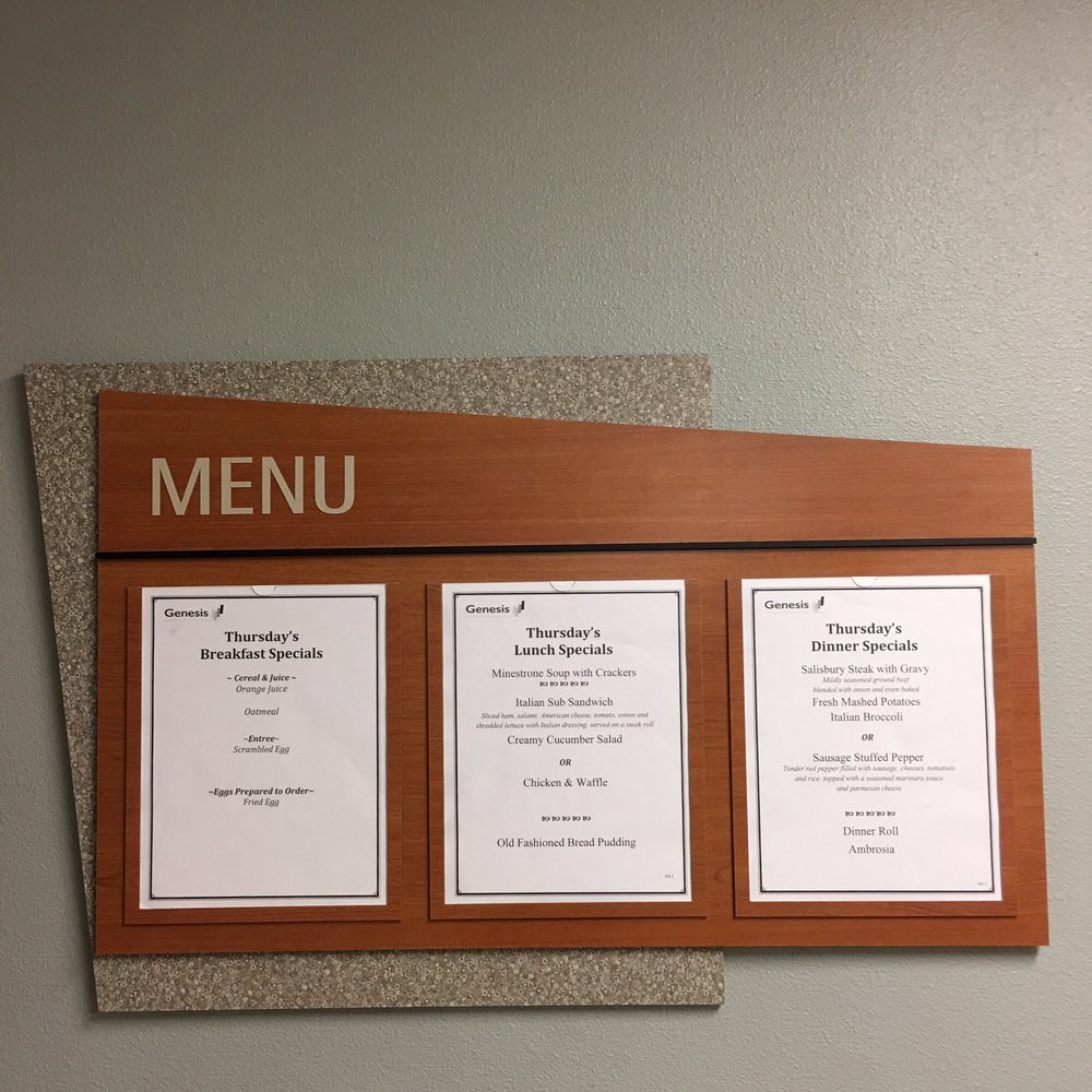 A wall-mounted menu board displaying three sections of printed menus.