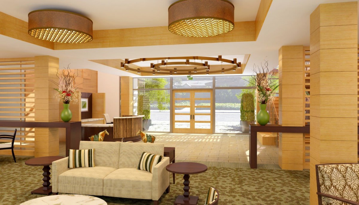 A luxurious hotel lobby featuring modern decor with wood accents and elegant chandeliers.