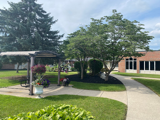 A serene outdoor space featuring well-kept gardens and walkways.