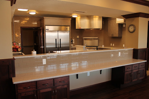 A modern and spacious kitchen featuring sleek appliances and an elegant countertop.