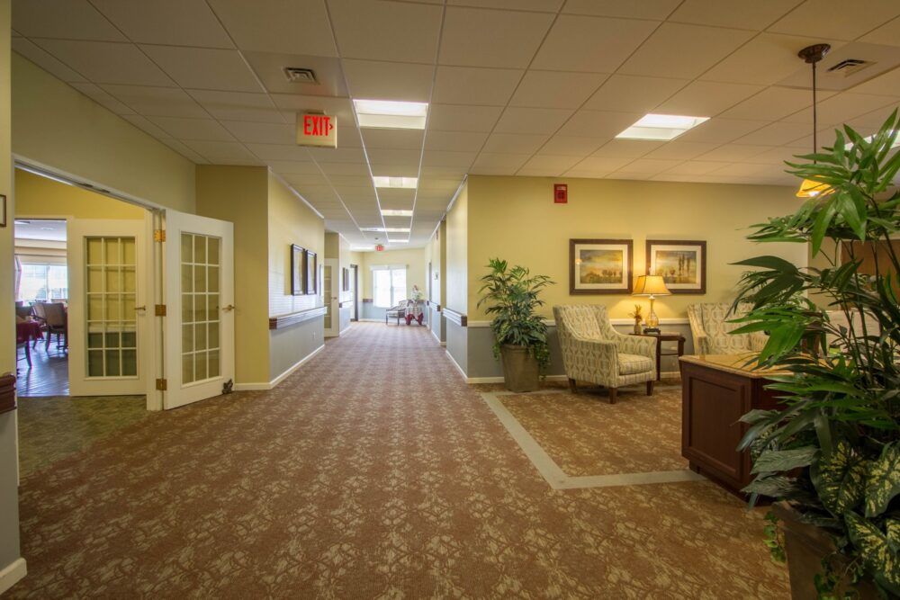 A well-lit hallway with comfortable seating and decorative elements.
