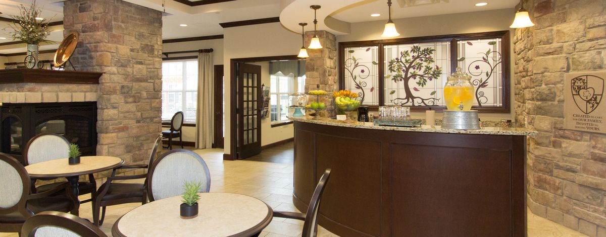 A modern reception area with stylish furnishings and decorative elements.