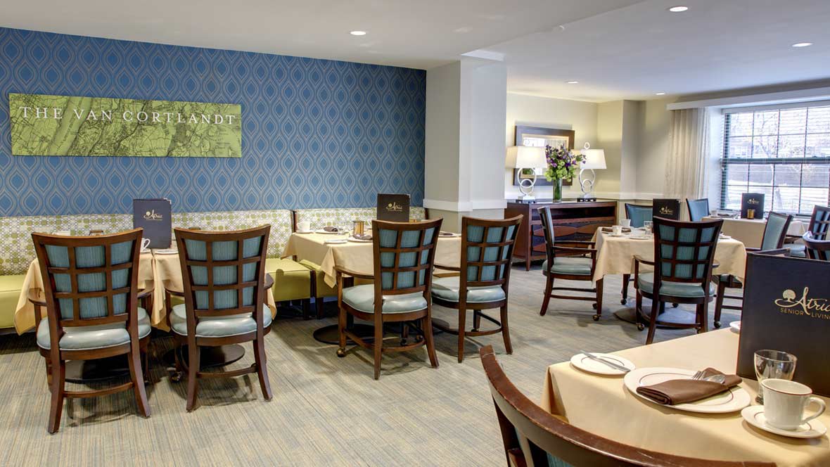 Elegant dining area with neatly arranged tables and chairs.