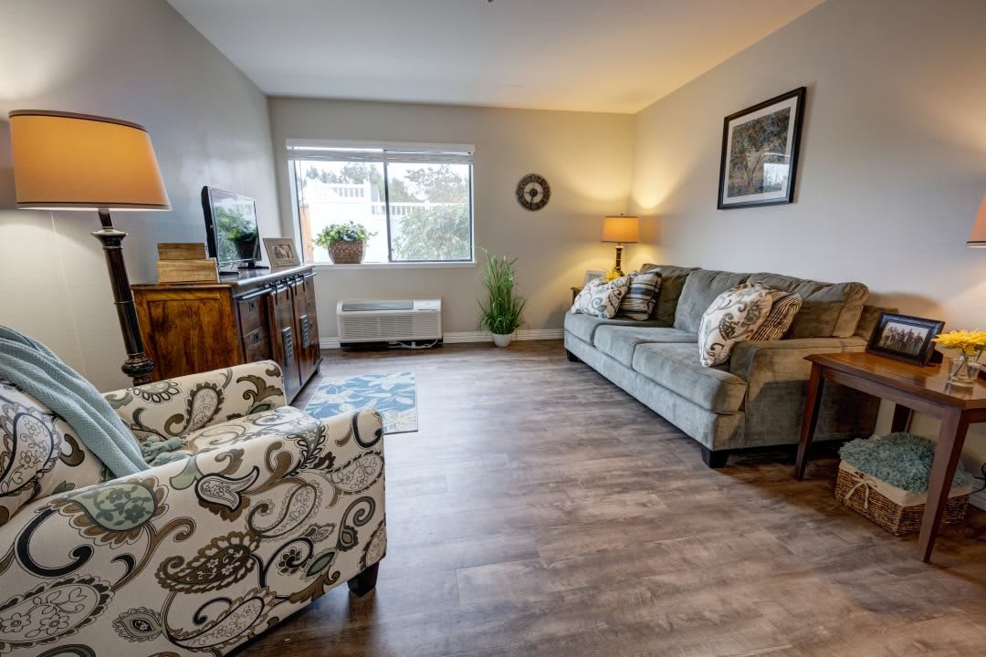 A cozy living room with modern furniture and decor.