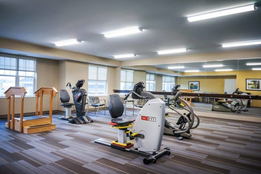 A well-equipped gym with various exercise machines and fitness equipment.