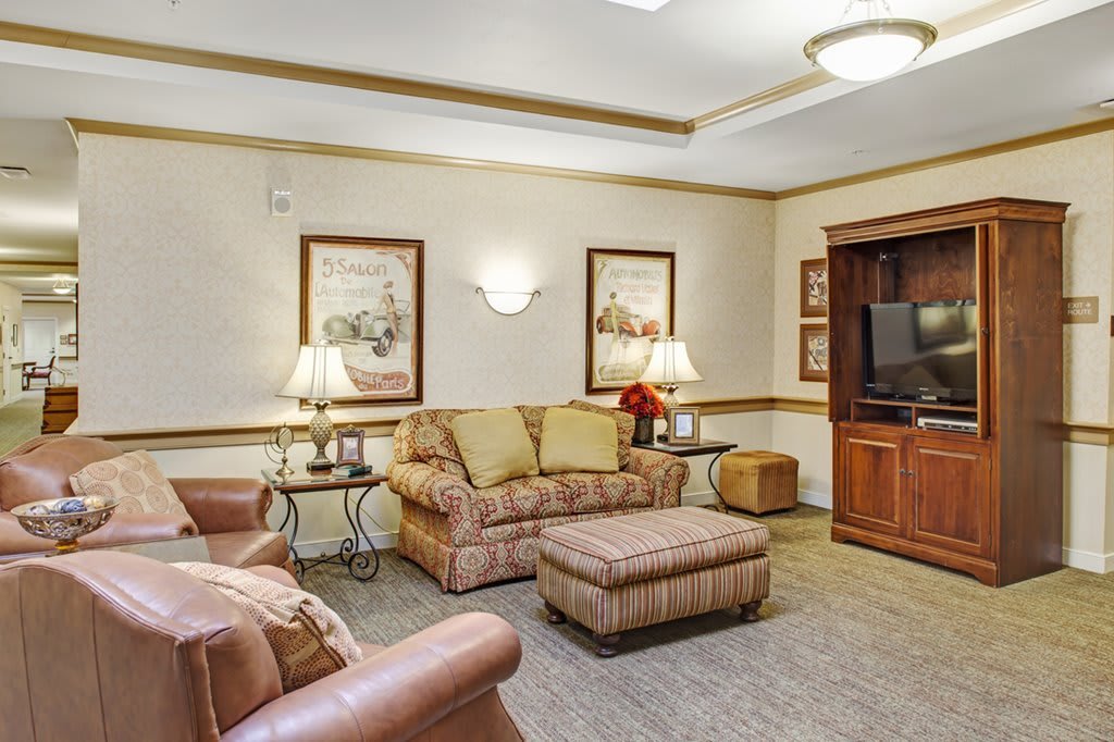 A cozy living room with comfortable seating and elegant decor.