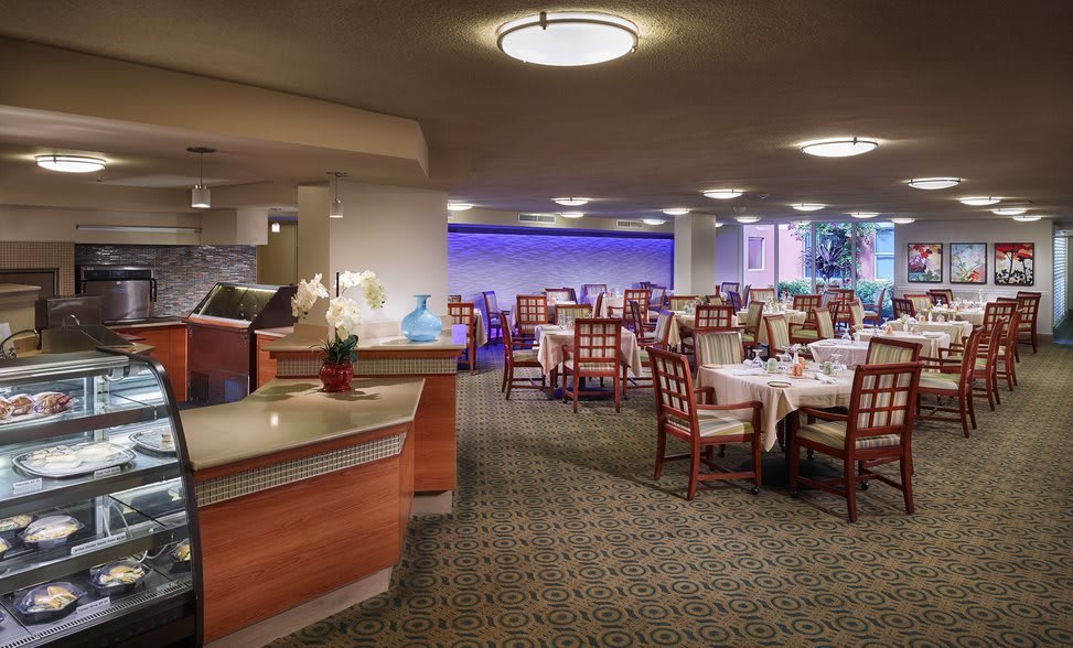 An indoor dining area with neatly arranged tables and chairs.
