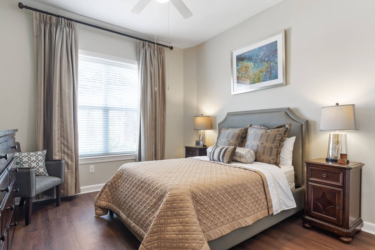 A cozy bedroom with elegant decor and natural light.