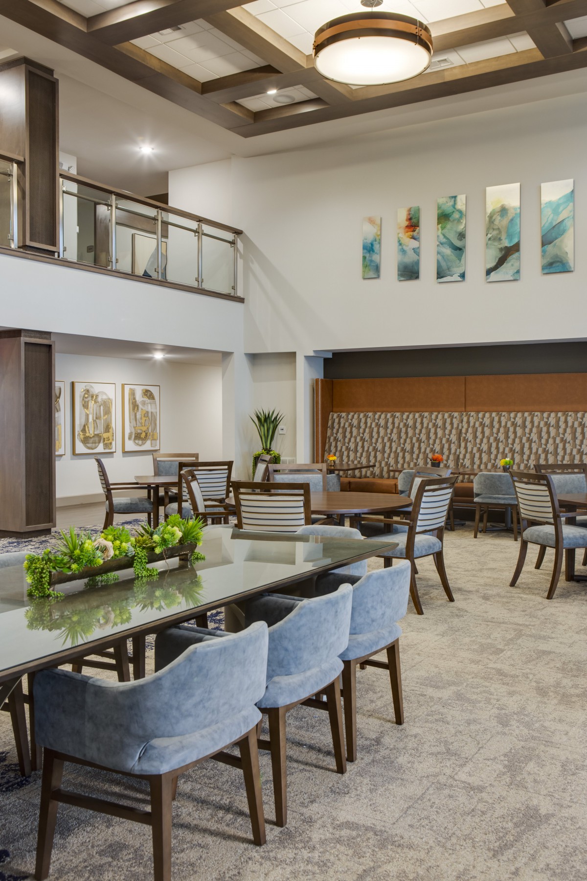 A modern lobby with stylish furniture and decorative artwork.