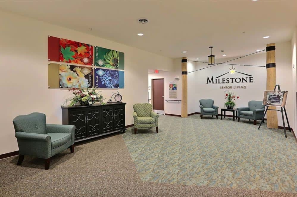An inviting lobby with comfortable seating and colorful artwork on the walls.
