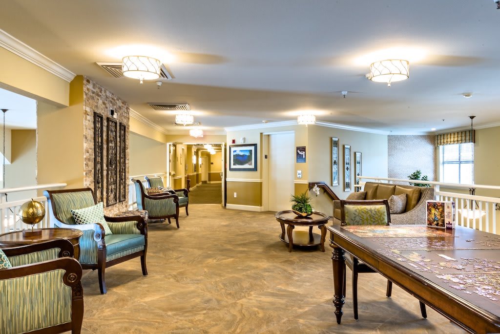 A cozy modern lobby area with comfortable seating and elegant lighting.
