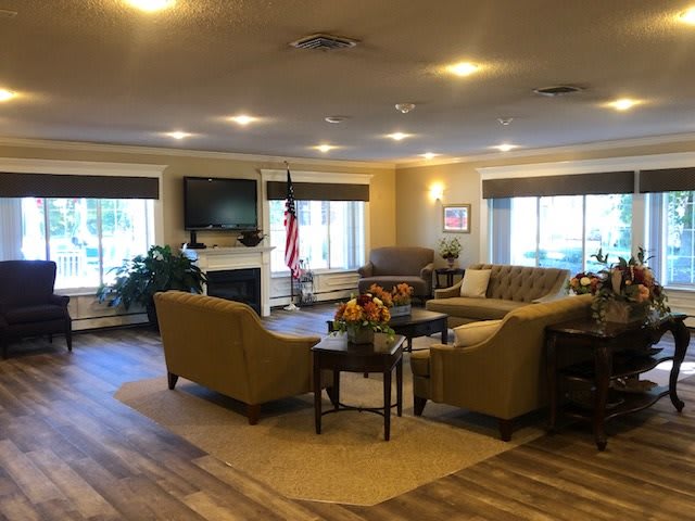 A cozy and modern living room with sofas, a coffee table, and a TV.