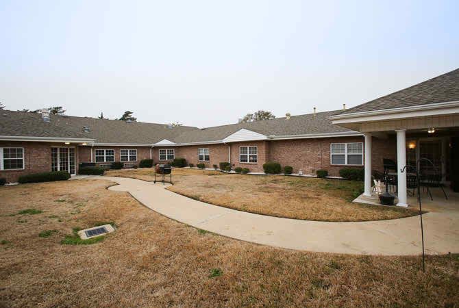 A residential building with a courtyard and walkway.
