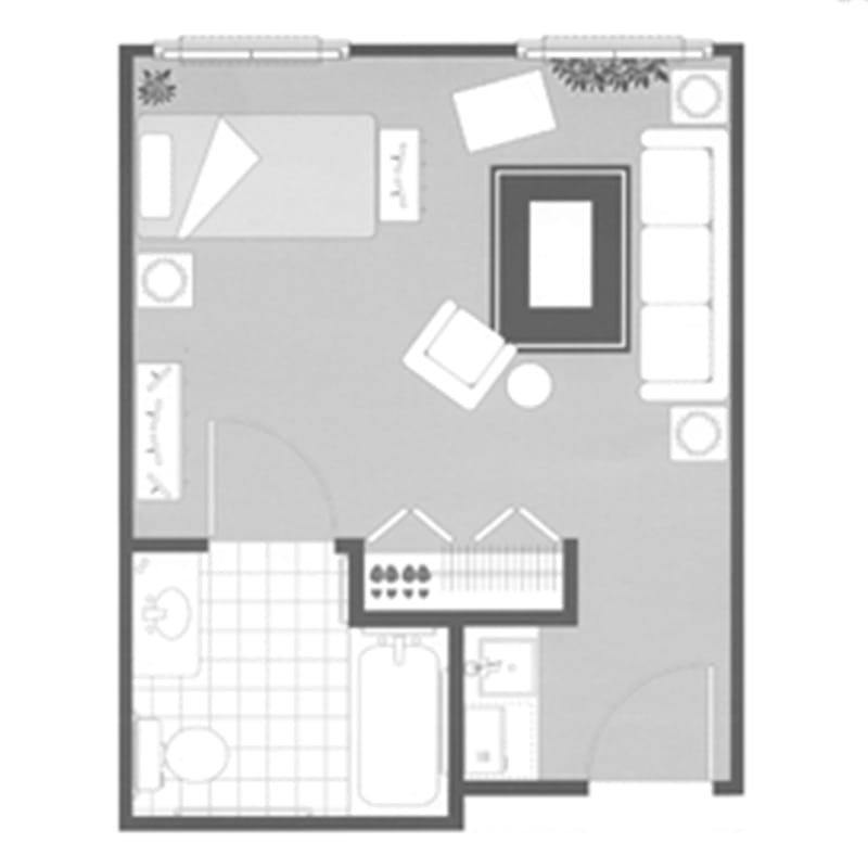 A floor plan of a studio apartment showing a compact layout with designated areas for sleeping, living, and kitchen.