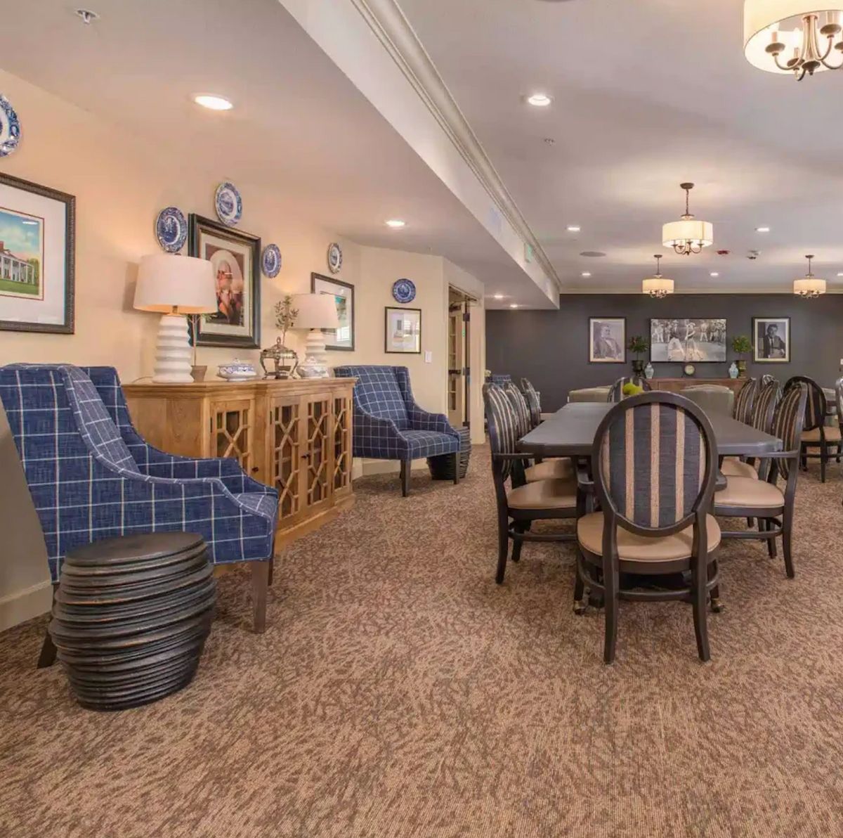 A spacious dining room interior featuring elegant furniture and decor.