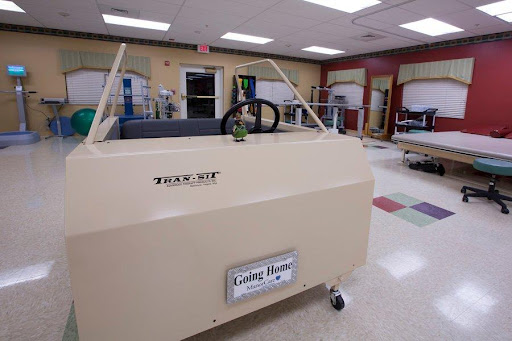 A specialized therapy vehicle designed for rehabilitation purposes in a medical setting.