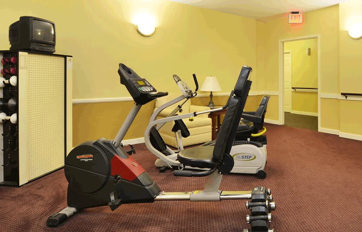 A small indoor gym with exercise bikes and fitness equipment.
