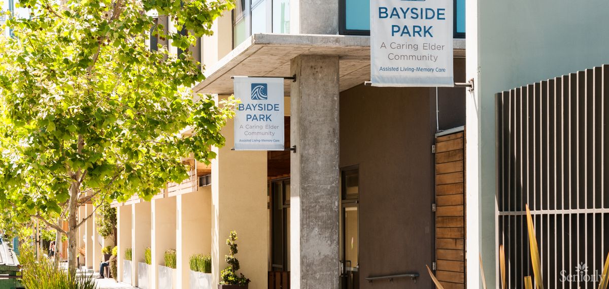 An outdoor view of the Bayside Park building with signage displayed.