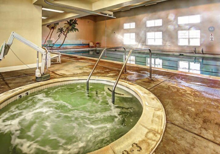 An inviting indoor pool and hot tub area designed for relaxation.
