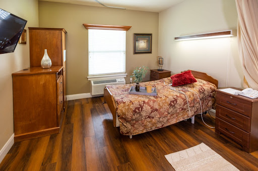 A cozy and well-decorated bedroom featuring wooden furniture and warm colors.