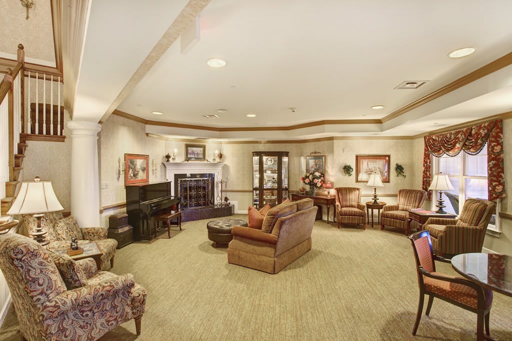 A cozy living room with comfortable seating and a fireplace.