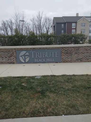 Entrance sign for Tribute at Black Hill apartment complex.